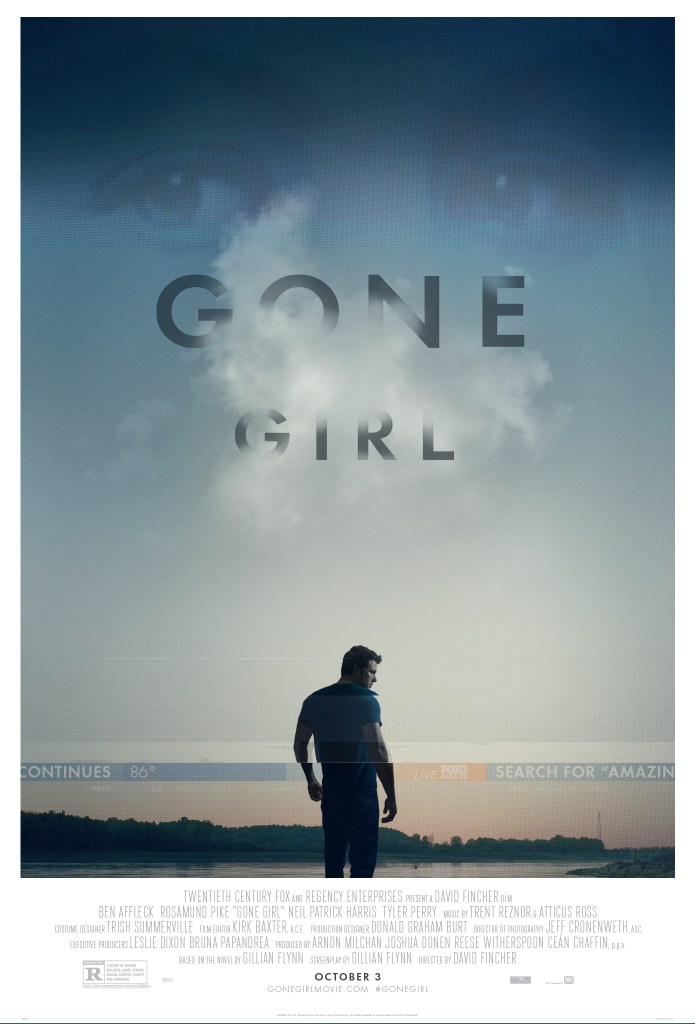 A film poster for the 2014 adaptation of gone girl. The poster is dominated by a landscape of a beach at dawn or dusk. A man (Ben Affleck) is in the foreground. He is turned half-away from the camera, so his face is in profile. Most of the man's body is visible, he wears a jumper and dark trousers. In the sky, above the man and the sea, there is some cloud. The words 'Gone Girl' are written over the cloud in a clean, all-cap sans serif font. They have been superimposed to look like they are fading into the cloud. Above the title a very faint pair of eyes are visible, these belong to Rosamund Pike, who plays Amy. At the bottom of the image, and equally faint, a news bulletin has been added over the man. The poster is complex, and gives a sense of loneliness, isolation, and mystery. 
